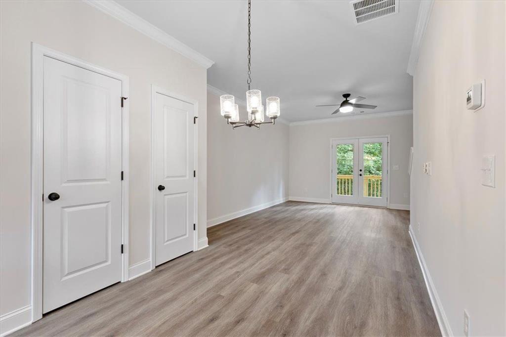 2486 Hidden Cove Court Gainesville, GA 30501 - Photo 14 of 29 wooden floor in an empty room with a window