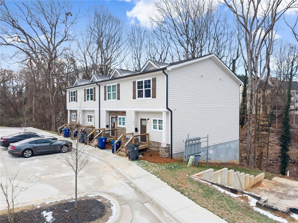 2486 Hidden Cove Court Gainesville, GA 30501 - Photo 2 of 29 a front view of a house with cars