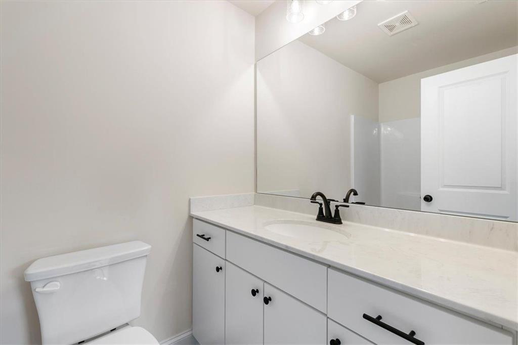 2486 Hidden Cove Court Gainesville, GA 30501 - Photo 22 of 29 a bathroom with a sink and a toilet