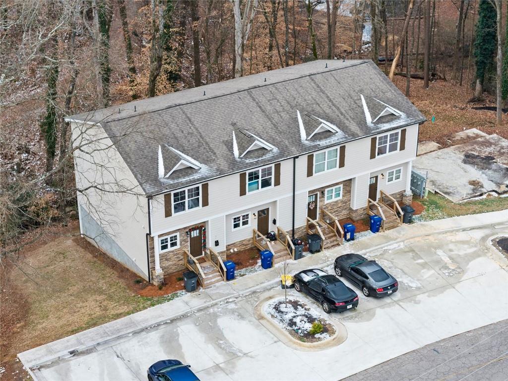 2486 Hidden Cove Court Gainesville, GA 30501 - Photo 3 of 29 a view of a white house with large windows