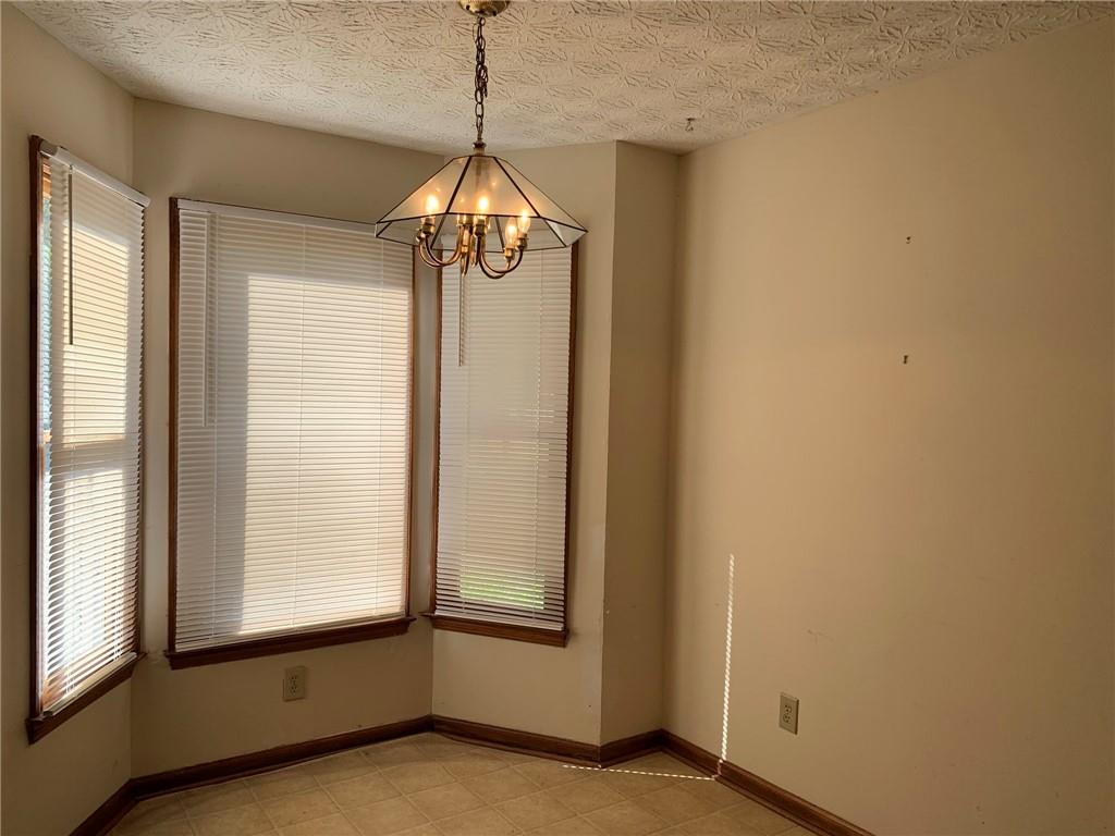 1103 Booth Court Southwest, Unit 1103 Marietta, GA 30008 - Photo 13 of 30 a view of an empty room with a window