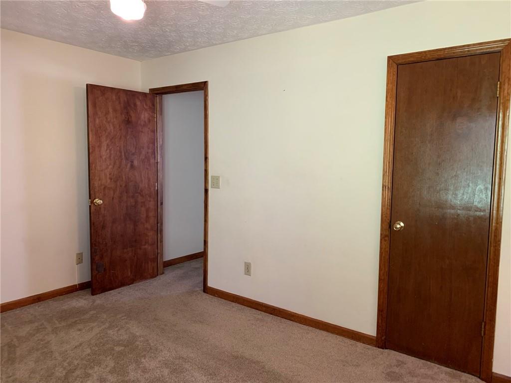 1103 Booth Court Southwest, Unit 1103 Marietta, GA 30008 - Photo 27 of 30 an empty room with closet area