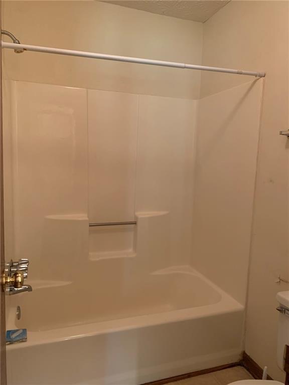 1103 Booth Court Southwest, Unit 1103 Marietta, GA 30008 - Photo 30 of 30 a bathroom with a shower and a bath tub