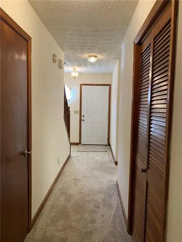 a view of a room with a hallway