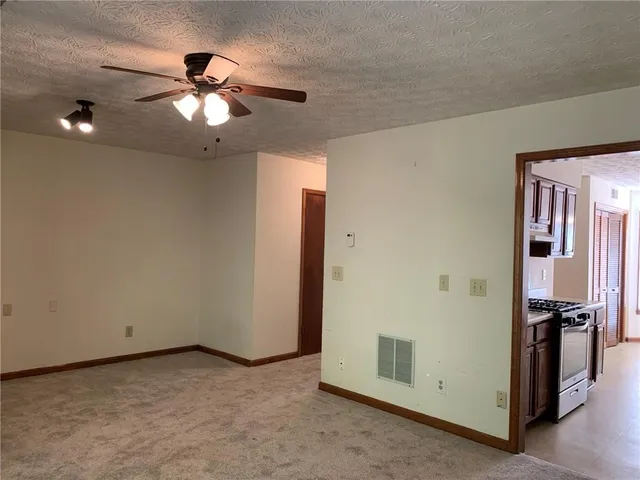 a view of a livingroom with furniture