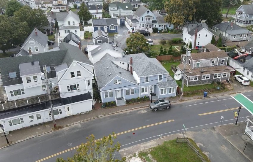 155 Onset Avenue, Unit E Wareham, MA 02558 - Photo 1 of 5 an aerial view of residential houses with outdoor space