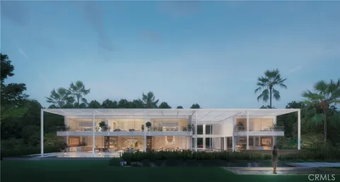 a front view of residential houses with yard and green space