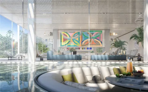 a living room with furniture and a floor to ceiling window