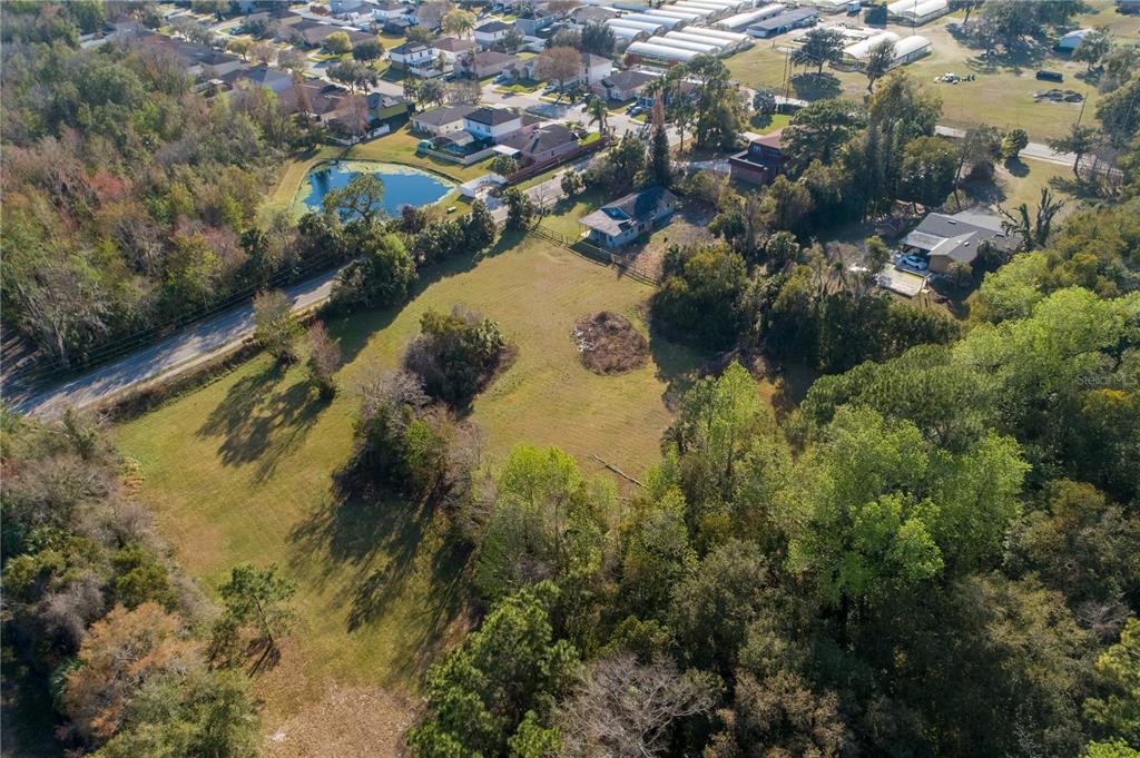 921 Vihlen Road Sanford, FL 32771 - Photo 11 of 26 an aerial view of residential houses with outdoor space and trees