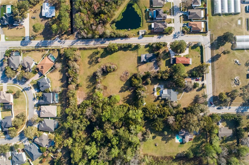 921 Vihlen Road Sanford, FL 32771 - Photo 7 of 26 an aerial view of residential houses with outdoor space