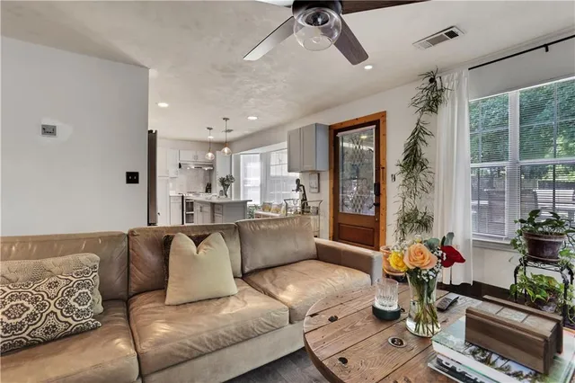 a living room with furniture and a large window