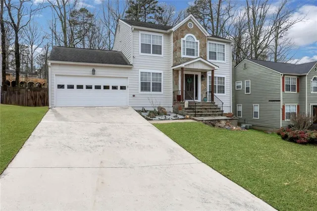 a front view of a house with a yard