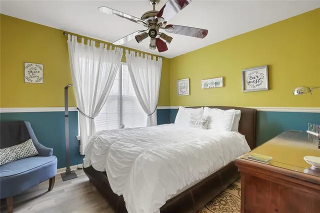 a bedroom with a bed and a couch