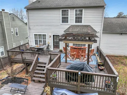 a view of a backyard with a large tree