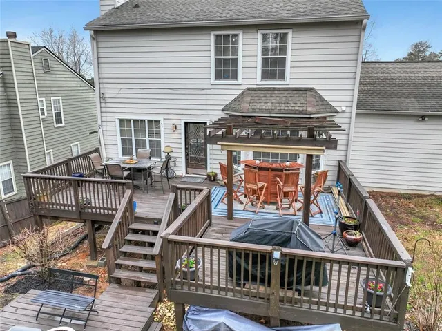 a view of a backyard with a large tree