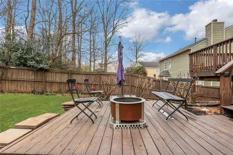 a view of a backyard with sitting area
