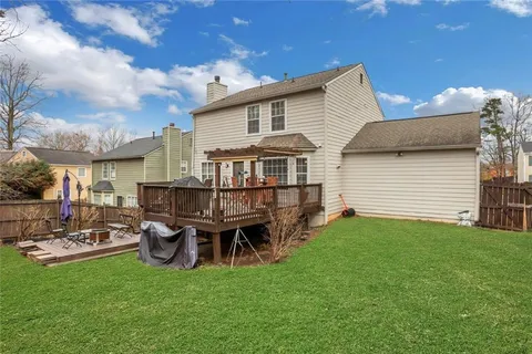 a bedroom with a bed and couch