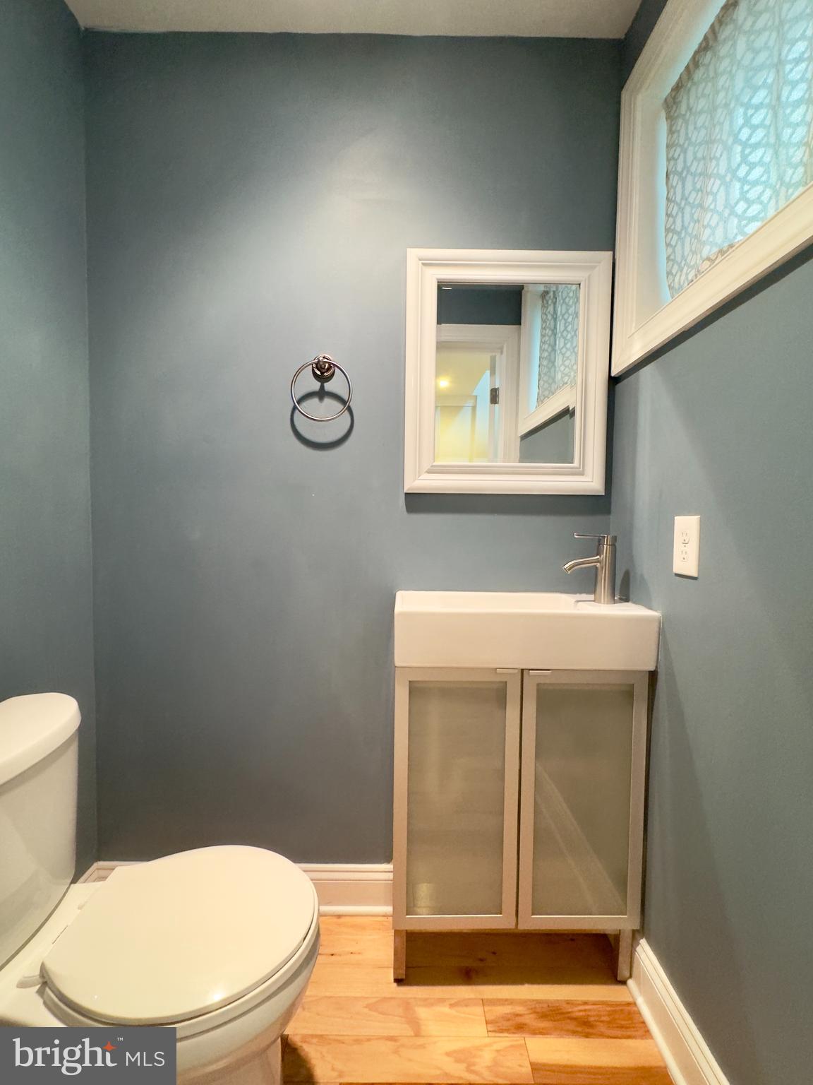 3533 Falls Road Baltimore, MD 21211 - Photo 12 of 20 a bathroom with a toilet and a sink