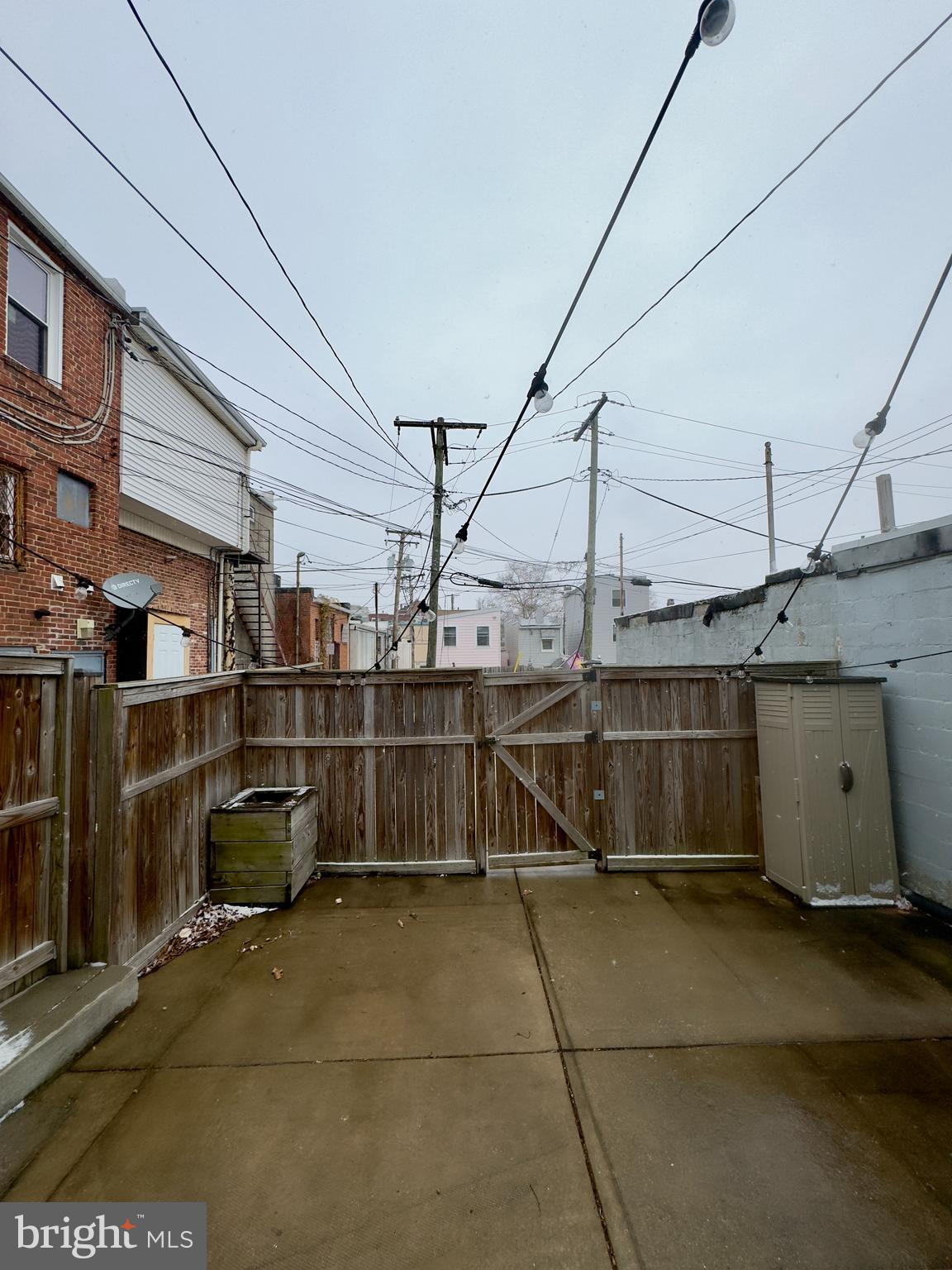 3533 Falls Road Baltimore, MD 21211 - Photo 16 of 20 a view of a garage with wooden fence