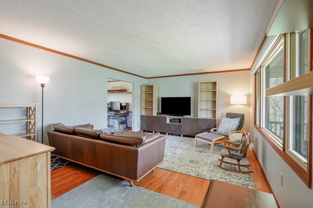 400 Eldridge Road Aurora, OH 44202 - Photo 12 of 42 Living area featuring with hardwood floors and large windows