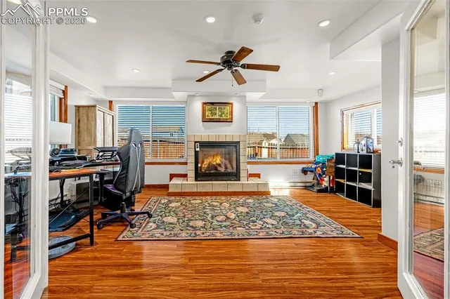 a bedroom with furniture and a wooden floor