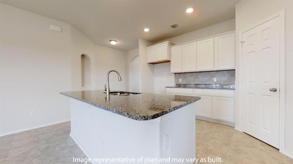 5800 Foggy Lagoon Drive Waco, TX 76708 - Photo 11 of 24 a kitchen with stainless steel appliances granite countertop a sink a stove and a refrigerator