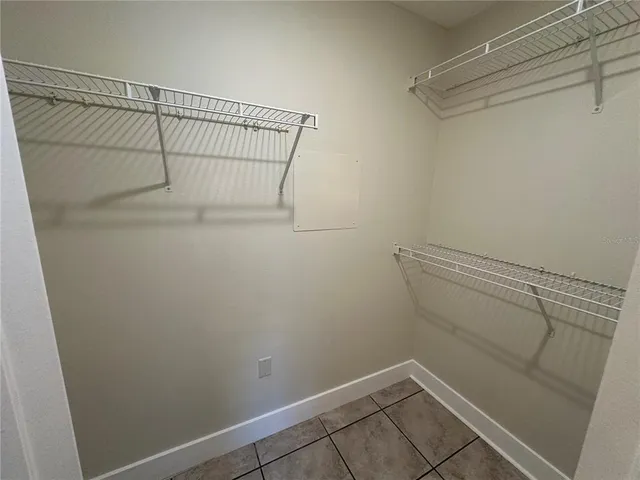 a view of a house with yard and sitting area