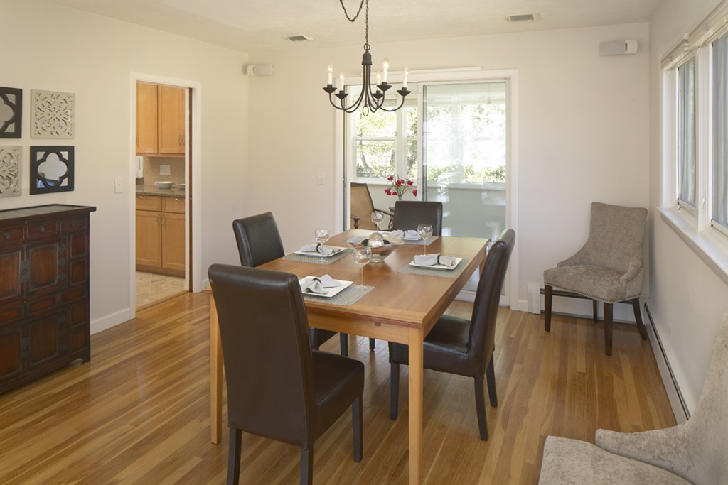 521 Clinton Road Brookline, MA 02467 - Photo 3 of 8 a view of a dining room with furniture window and wooden floor