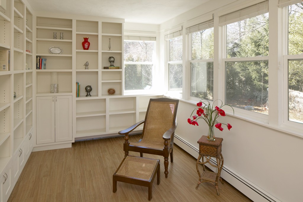 521 Clinton Road Brookline, MA 02467 - Photo 6 of 8 a living room with furniture cabinets and a window