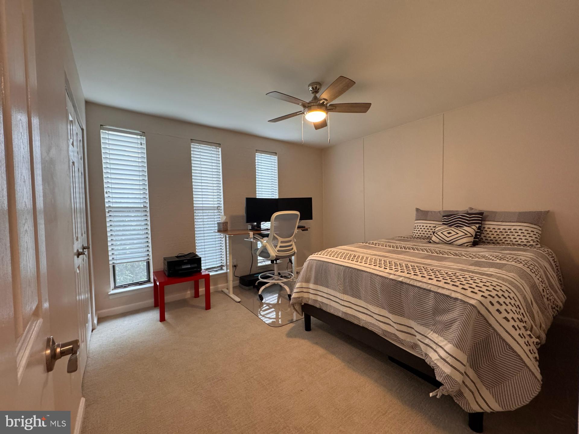 25 South Church Road, Unit 89 Maple Shade, NJ 08052 - Photo 12 of 24 a bedroom with a bed gym equipment and a window