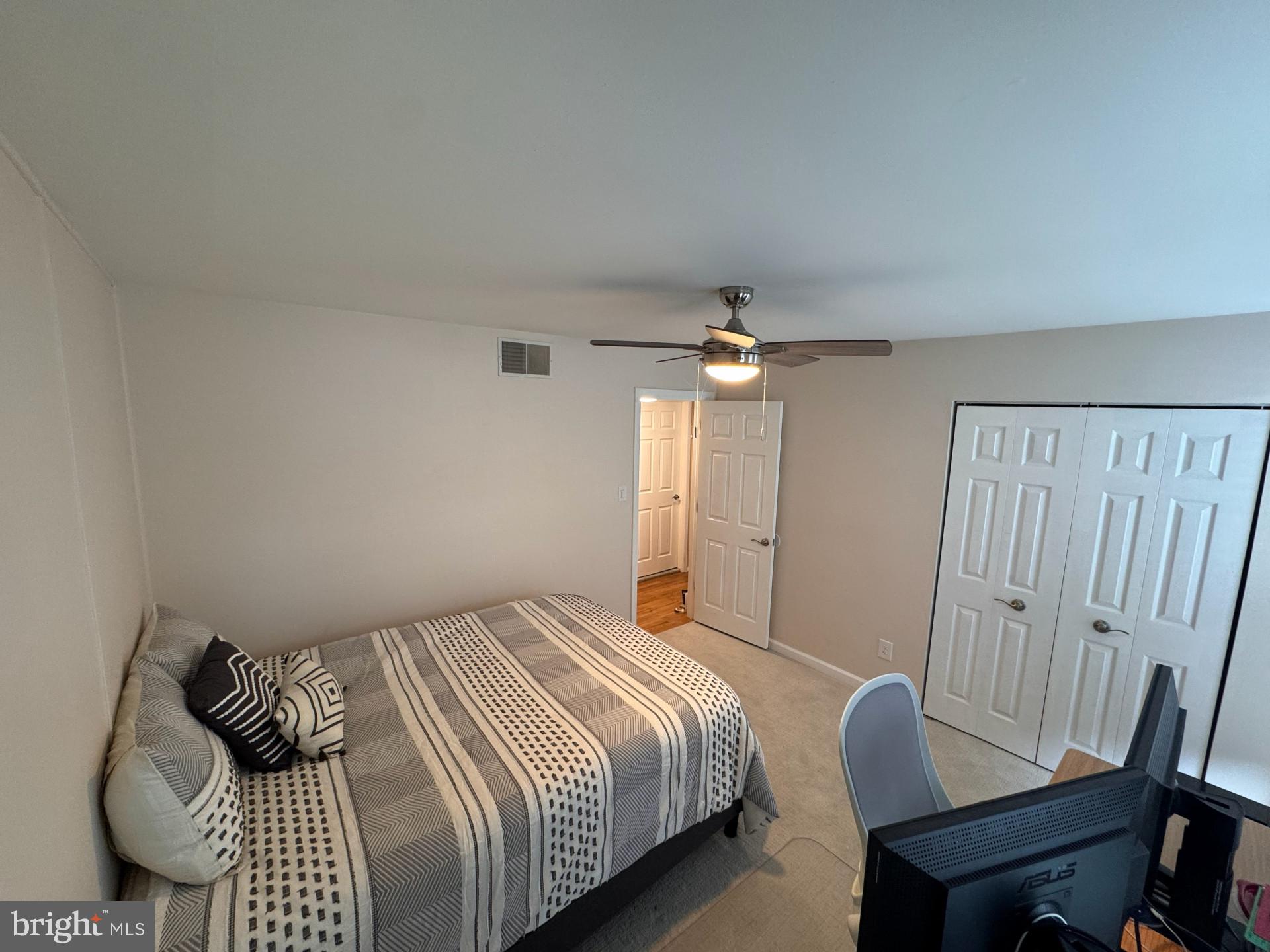 25 South Church Road, Unit 89 Maple Shade, NJ 08052 - Photo 13 of 24 a bedroom with a bed and wooden floor