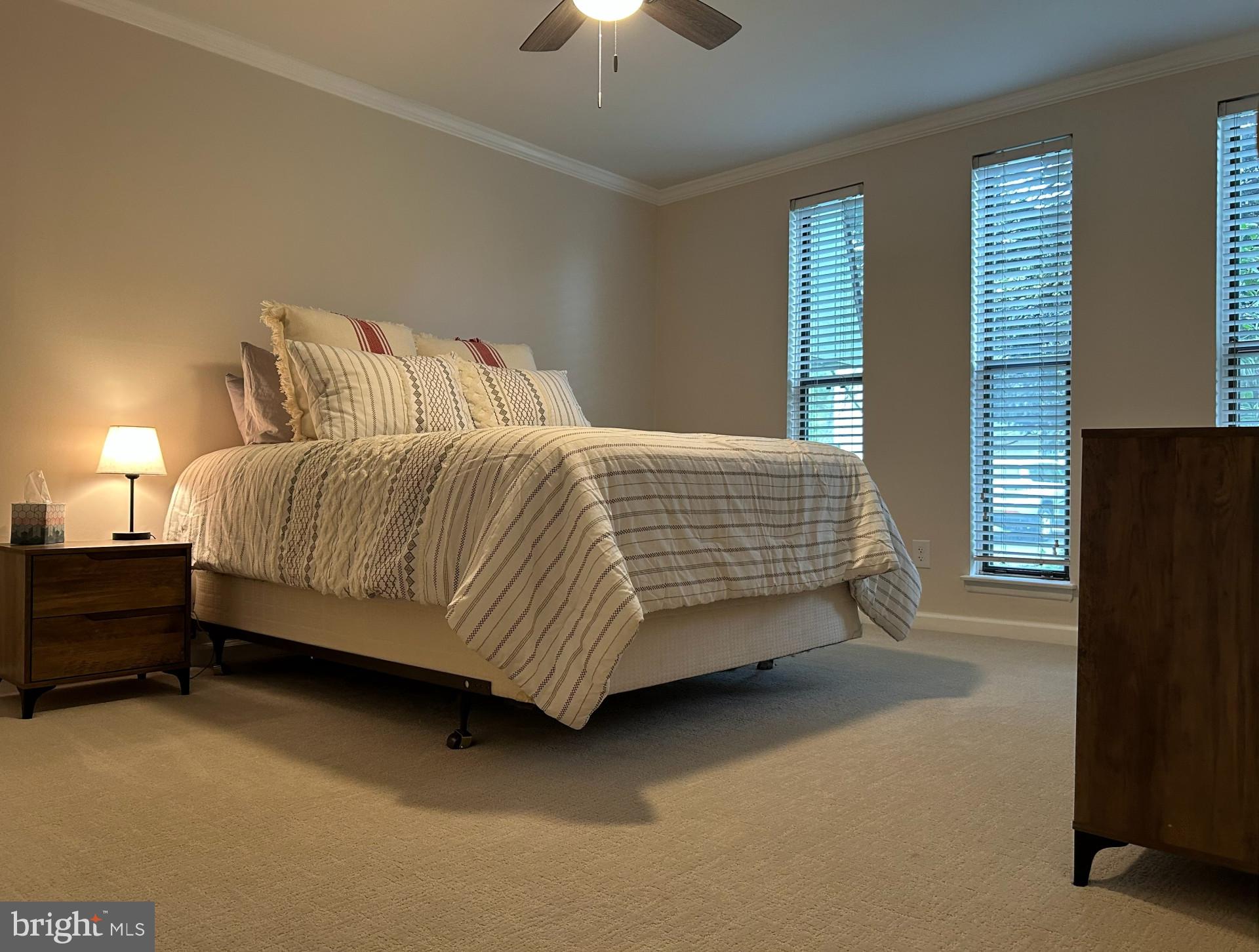 25 South Church Road, Unit 89 Maple Shade, NJ 08052 - Photo 14 of 24 a bedroom with a bed and a chandelier