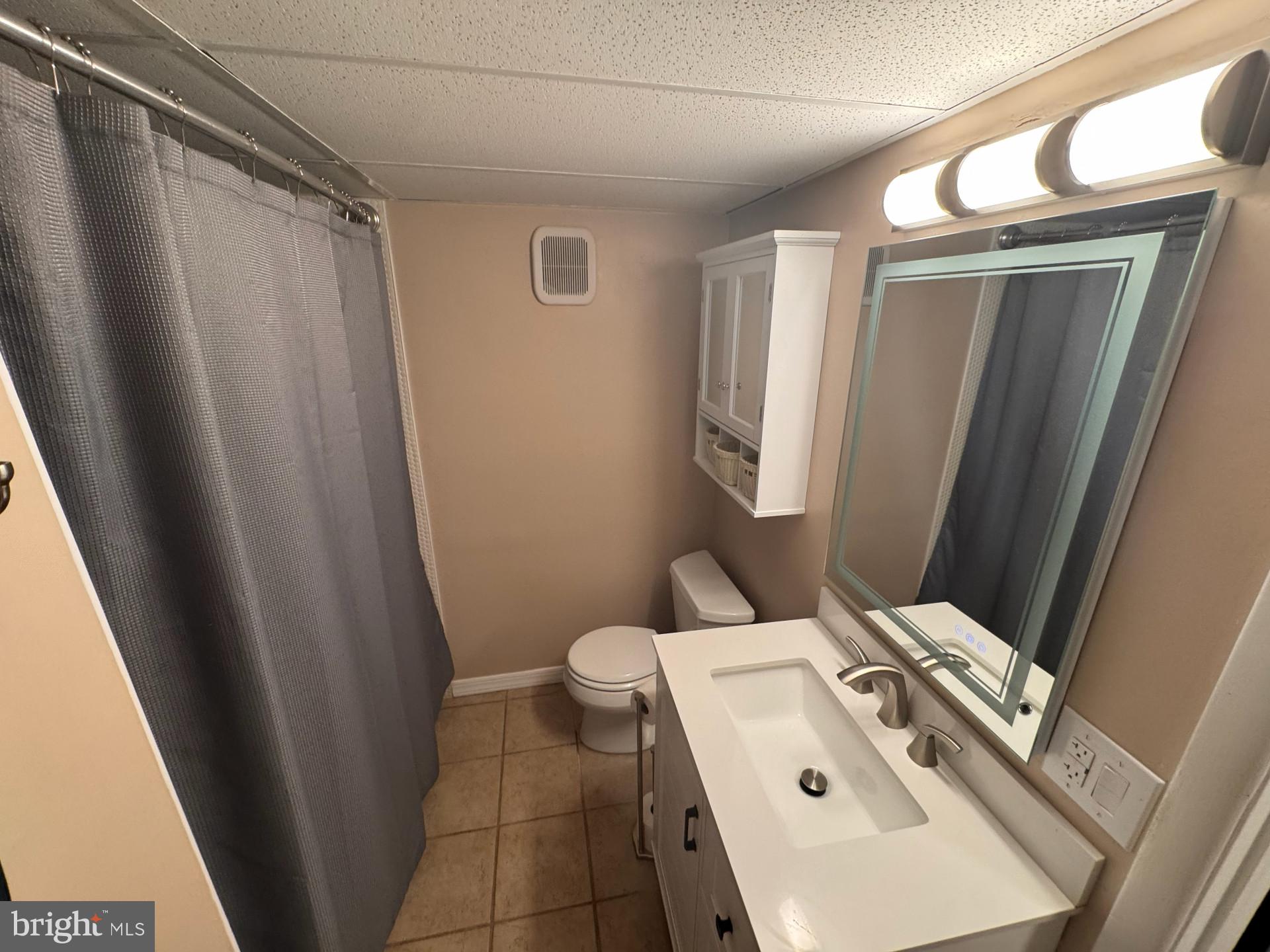 25 South Church Road, Unit 89 Maple Shade, NJ 08052 - Photo 17 of 24 a bathroom with a sink a toilet and mirror