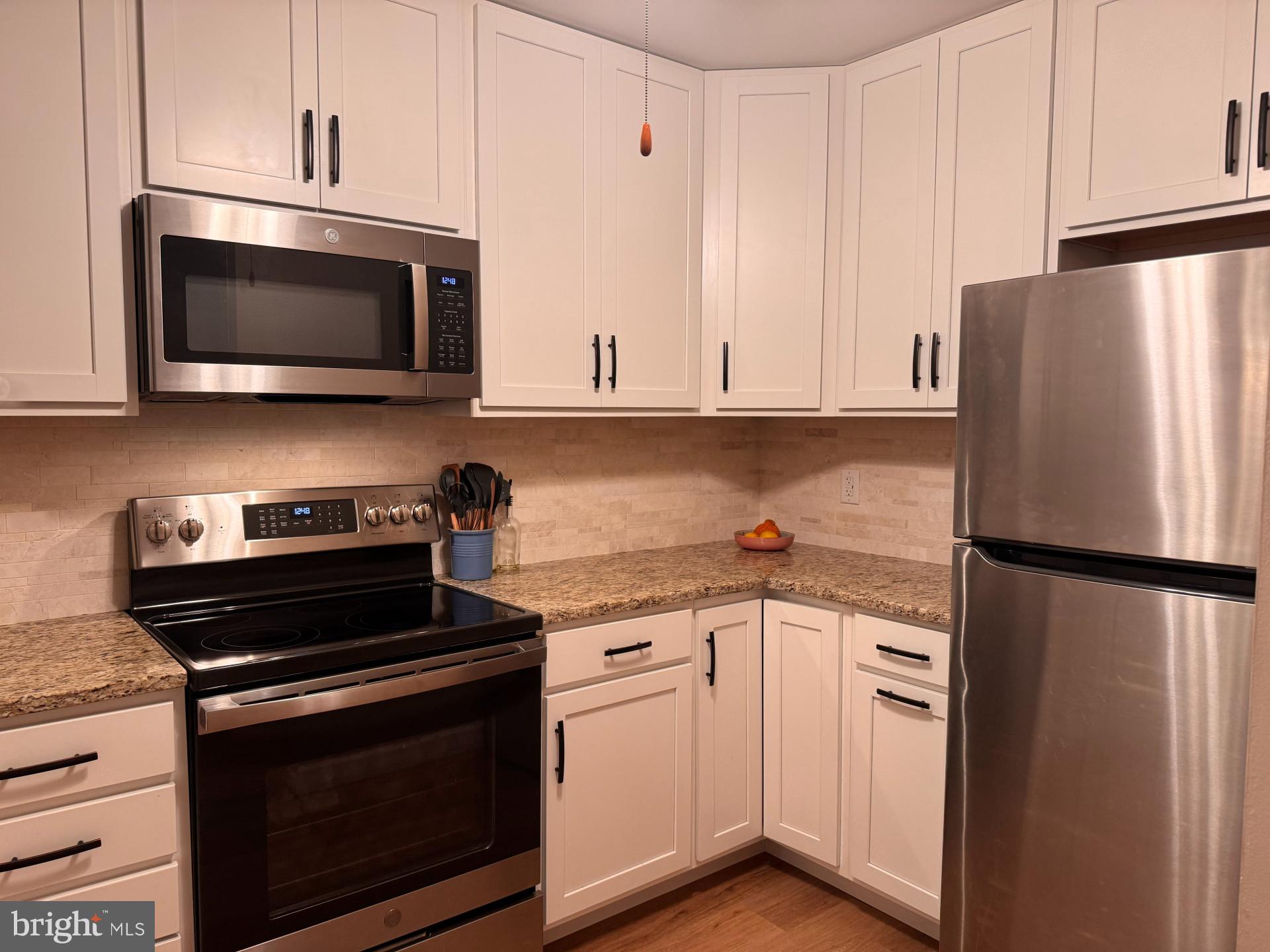 25 South Church Road, Unit 89 Maple Shade, NJ 08052 - Photo 2 of 24 a kitchen with cabinets and stainless steel appliances