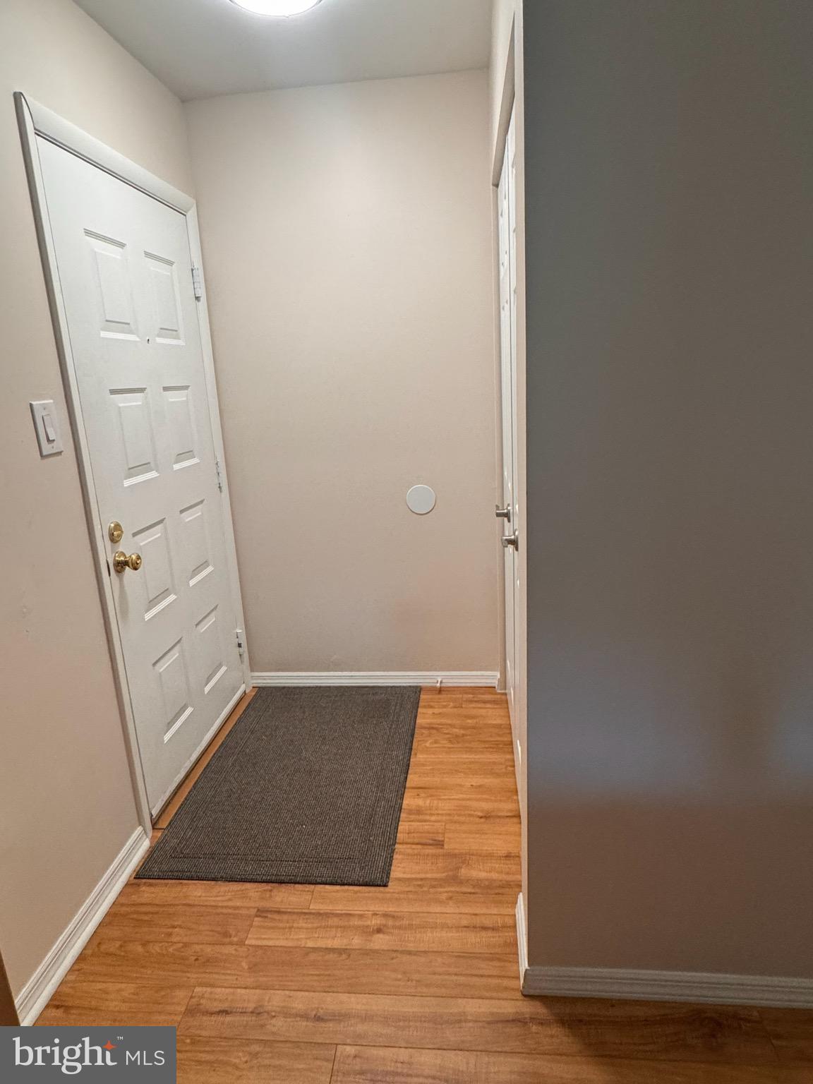 25 South Church Road, Unit 89 Maple Shade, NJ 08052 - Photo 22 of 24 an empty room with wooden floor and entrance