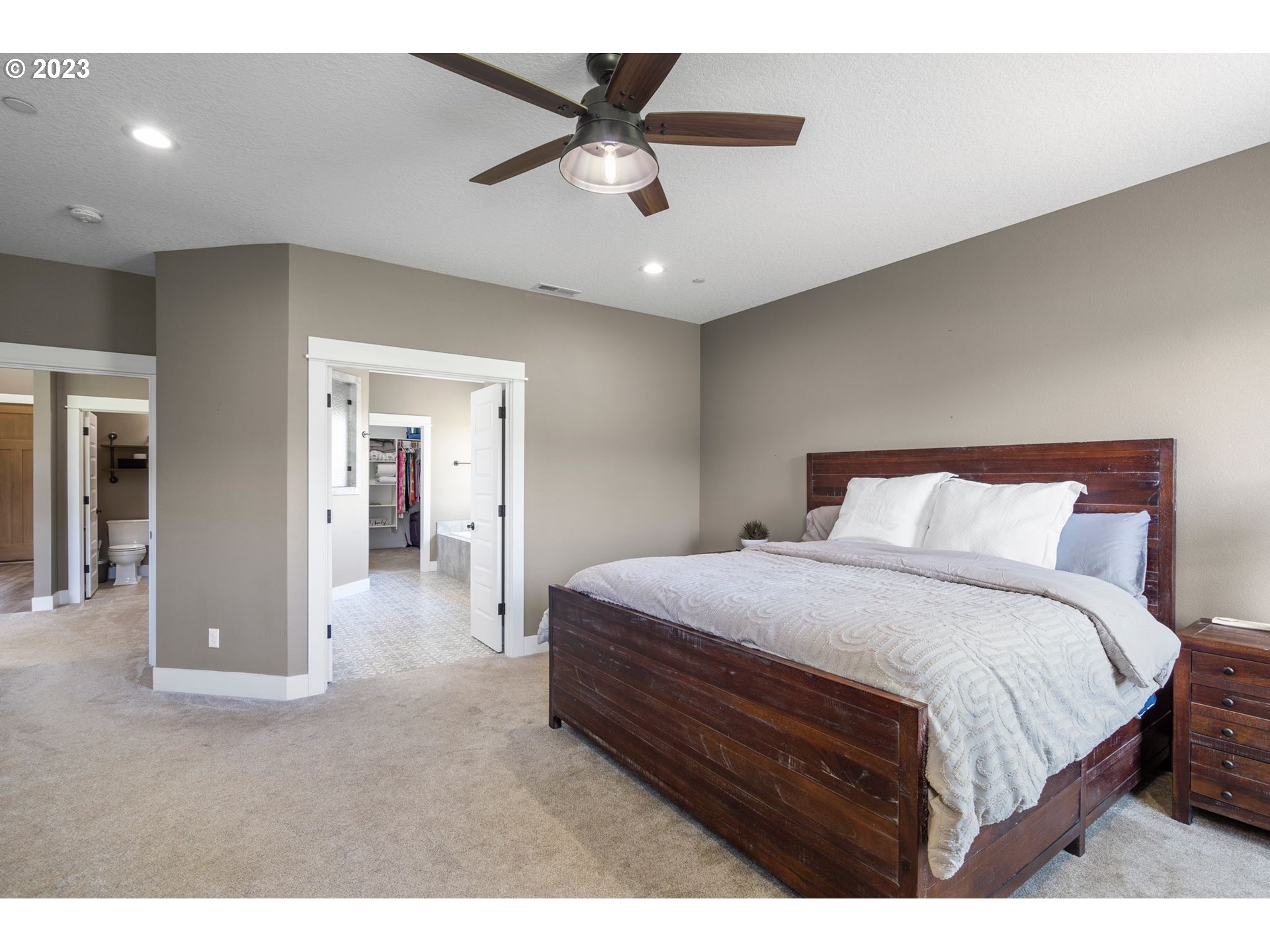 17792 South Strowbridge Road Oregon City, OR 97045 - Photo 23 of 32 a bedroom with a bed and a ceiling fan