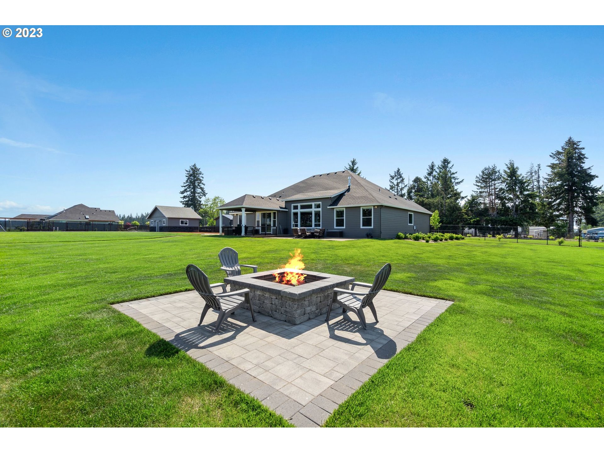 17792 South Strowbridge Road Oregon City, OR 97045 - Photo 8 of 32 a view of a chairs and table on the big yard