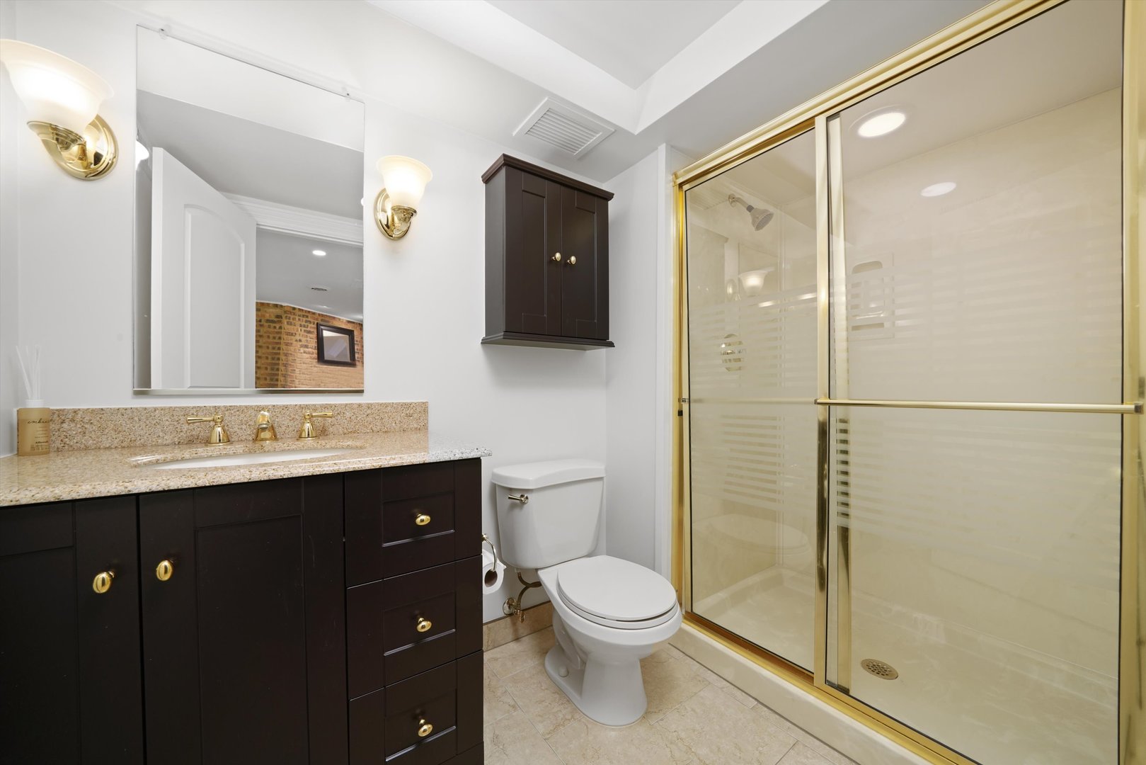 5N260 Eagle Terrace Itasca, IL 60143 - Photo 23 of 34 a bathroom with a toilet a sink and mirror