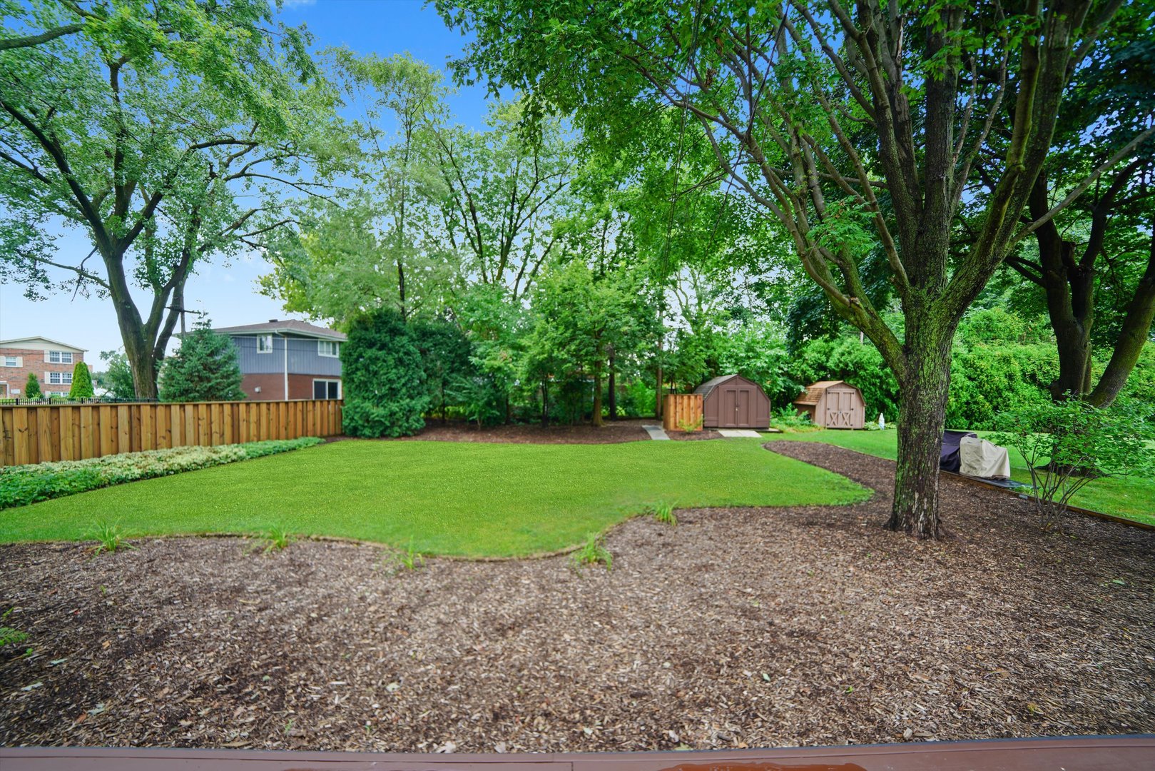 5N260 Eagle Terrace Itasca, IL 60143 - Photo 26 of 34 a view of a house with a yard and a large tree