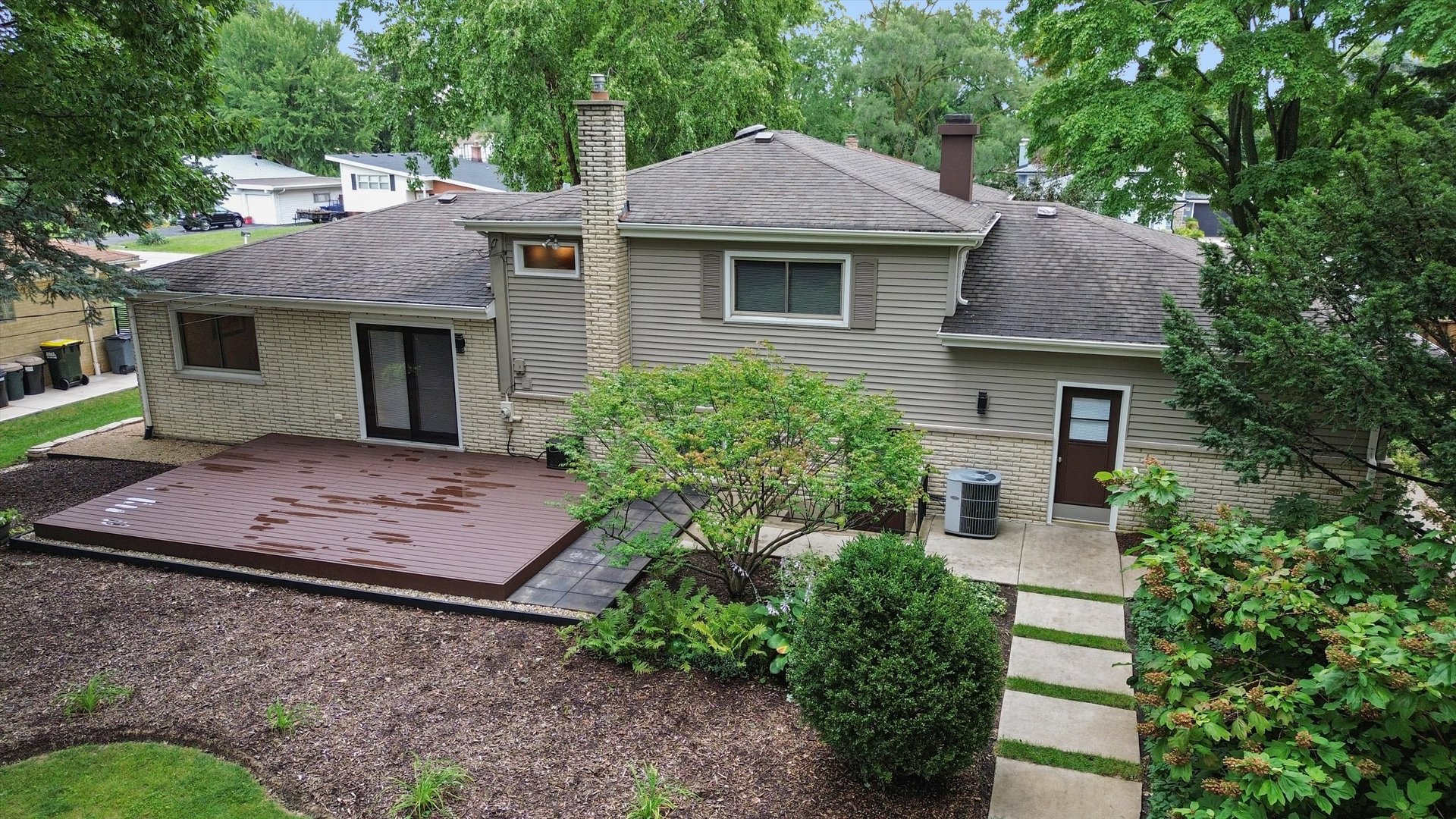 5N260 Eagle Terrace Itasca, IL 60143 - Photo 6 of 34 a front view of a house with a garden and trees