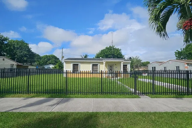 a view of a street with a fence