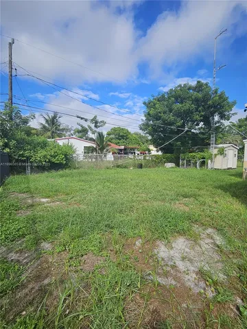 a backyard with a garden and entertaining space