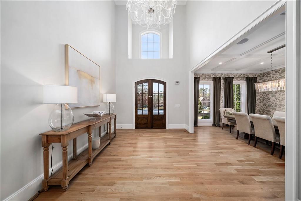 1002 Overlook Terrace Ball Ground, GA 30107 - Photo 12 of 100 a view of a hallway with wooden floor and furniture