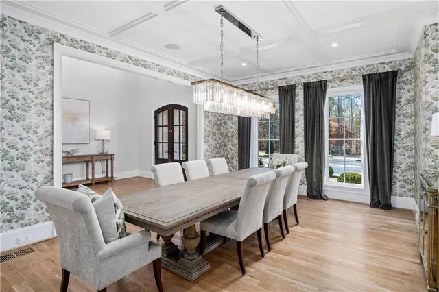 a bathroom with a granite countertop toilet sink and mirror
