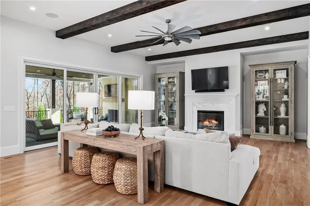 a bedroom with a large bed and a fireplace