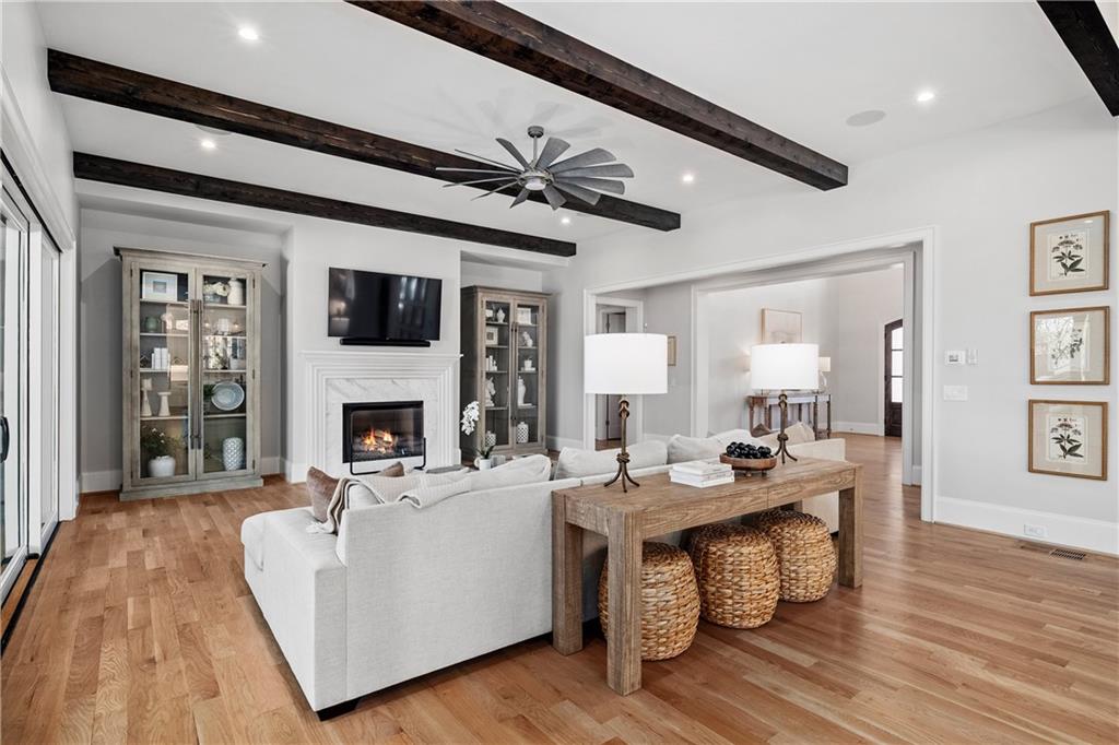 1002 Overlook Terrace Ball Ground, GA 30107 - Photo 18 of 100 a living room with furniture a fireplace and a flat screen tv