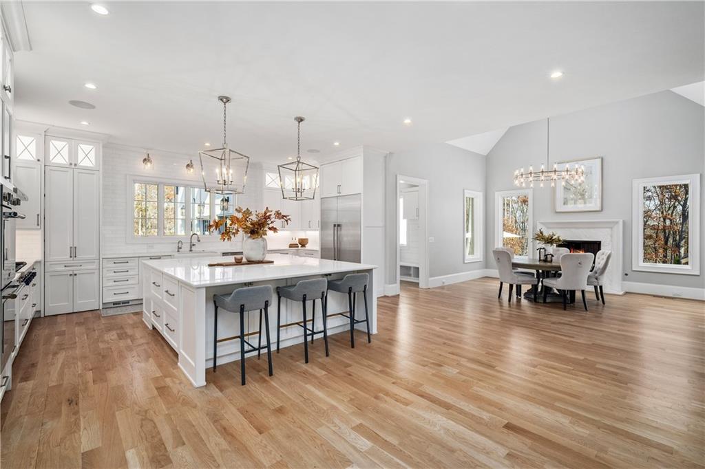 1002 Overlook Terrace Ball Ground, GA 30107 - Photo 22 of 100 a view of a dining room with furniture and wooden floor