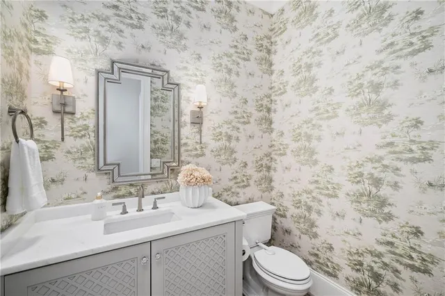 a bathroom with a double vanity sink mirror and