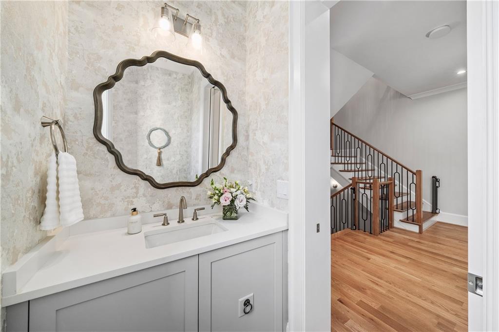1002 Overlook Terrace Ball Ground, GA 30107 - Photo 38 of 100 a en suite bathroom with a sink and mirror
