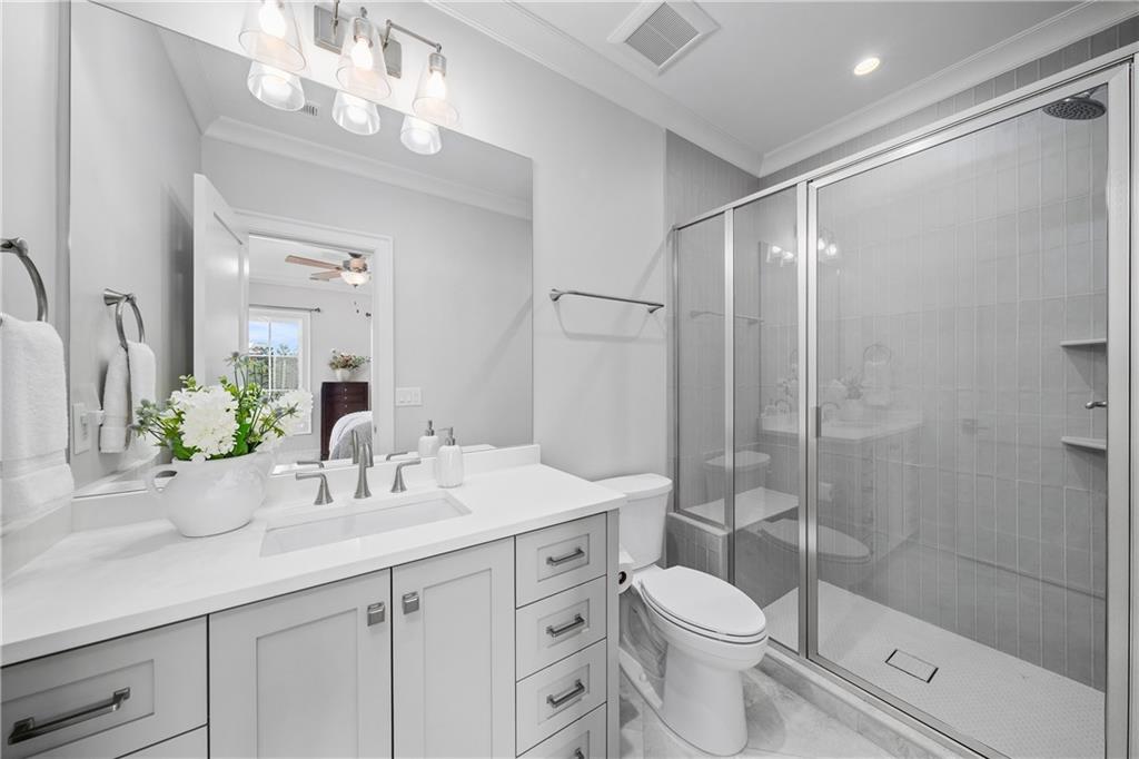 1002 Overlook Terrace Ball Ground, GA 30107 - Photo 48 of 100 a bathroom with a sink a toilet and shower